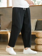 Plus size black wide-leg drawstring pants with white tie and pockets