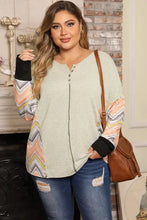 Plus size exposed seam print long sleeve T-shirt with waffle knit and ripped jeans