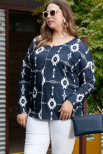 Plus size exposed seams round neck Aztec print top with white pants