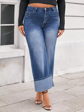 Plus size high waist wide leg blue denim jeans with rolled cuffs and cuffed wide leg design for a stylish fit