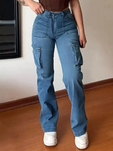 Plus size light-wash blue high-waisted cargo jeans made of denim with large side pockets and a high-rise waist