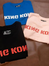 Three plus size King Kong round neck t-shirts in blue, black, and light pink
