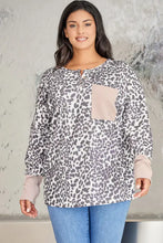 Plus size leopard print long sleeve sweatshirt with tan pocket and cuffs