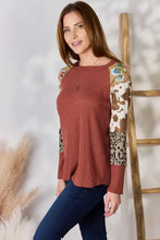 Plus size leopard waffle-knit blouse in rust with animal print sleeves
