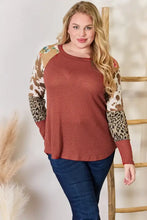 Plus size leopard waffle-knit blouse in rust with animal print sleeves