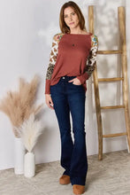 Plus size leopard waffle-knit blouse in rust with animal print sleeves