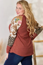 Plus size leopard waffle-knit blouse with floral animal print sleeves and brooch