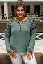 Plus size leopard waffle-knit long sleeve t-shirt with white pants
