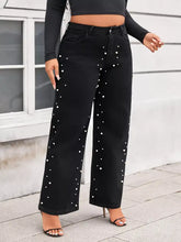 Plus size black denim pearl embellished wide leg jeans with white pearl studs along the sides for a stylish look