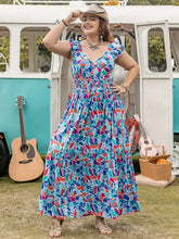 Plus size printed cap sleeve dress with colorful abstract pattern
