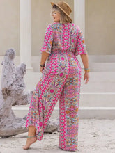 Plus size printed wide leg jumpsuit in vibrant pink pattern