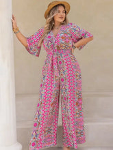 Plus size printed wide leg jumpsuit in vibrant pink pattern
