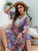 Plus size printed lace short sleeve boho maxi dress with crochet neckline, ruffled sleeves, and woven straw hat