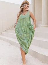 Plus size printed V-neck wide leg jumpsuit in flowing green fabric
