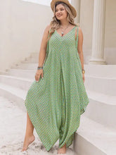 Plus size printed v-neck wide leg jumpsuit in flowing green pattern
