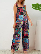 Plus size printed wide leg jumpsuit in vibrant paisley and geometric patterns