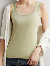 Plus size ribbed scoop neck tank top in soft sage green with ribbed texture and thin straps