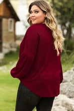 Plus size round dropped shoulder long-sleeve burgundy top with jeans