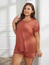 Plus size rust-colored two-piece loungewear set with round neck and short sleeve length in lightweight flowing fabric