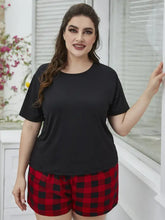 Plus size black short-sleeved cotton tee shirt with round neck paired with plaid shorts lounge set