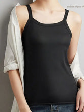 Black ribbed plus size scoop neck tank top with spaghetti straps made from soft knit fabric for casual wear