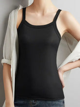 Plus size scoop neck tank top in black ribbed fabric with spaghetti straps for comfortable casual wear