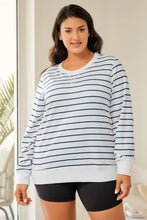 Plus size striped round neck long sleeve t-shirt on woman in black shorts