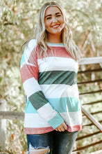 Plus size striped slit long sleeve top with distressed denim pants