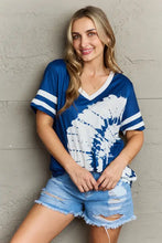 Plus size V-neck tee shirt in blue white tie-dye with regular sleeve length and distressed denim shorts