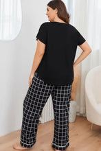 Plus size v neck top with sleeve length detail paired with black and white grid-patterned soft plaid pants lounge set