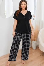 Plus size v-neck top and plaid pants lounge set featuring relaxed fit black and white grid-patterned pajama pants with sleeve length detail