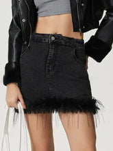 Black denim mini skirt with plush fuzzy fringe hem showcasing a stylish mini denim skirt design