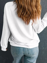 White plush leopard tree patched sweatshirt with relaxed fit ribbed cuffs and slightly stretchy fabric, machine wash safe