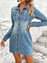 A fitted medium-wash long sleeve denim dress with collar front buttons and pockets