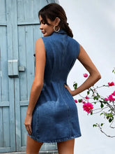 A fitted sleeveless denim dress in medium blue wash with collar and back seam detail for casual wear