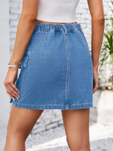 Blue denim mini pocketed buttoned denim skirt with elastic waistband and side pocket for casual wear