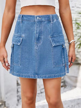 Blue denim pocketed buttoned denim skirt mini style with two large cargo pockets on the sides