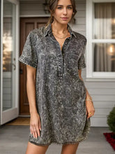 Women’s pocketed collared neck short sleeve denim dress in faded gray and black marbled pattern with frayed hem