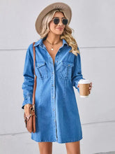 Blue denim mini dress with button front chest pockets and dropped shoulder design in lightweight denim fabric
