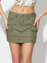 Olive green mini denim skirt with two large flap pockets and button closure pocketed mini denim skirt