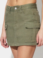 Olive green pocketed mini denim skirt made of cargo denim ideal for casual wear and versatile styling