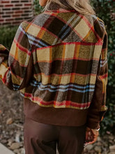 Pocketed plaid long sleeve jacket in brown, yellow, red flannel