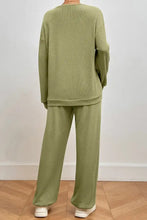 Cozy olive green waffle-knit pocketed round neck top and pants lounge set with relaxed fit and long sleeve length