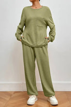 Olive green waffle-knit two-piece loungewear set with pocketed round neck top and long sleeve length pants