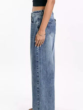 High waisted wide leg jeans in faded medium blue denim with classic stitching and button fly pocketed wide leg jeans
