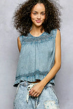 Blue denim sleeveless cotton blouse with embroidered detailing ruffled hem and pol button closure on back