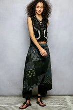 Black patchwork maxi skirt with intricate lace and embroidery paired with pol button cropped crochet vest with scalloped edge