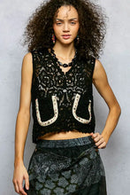 Black lace pol button down cropped crochet vest with scalloped edge featuring floral patterns and horseshoe appliqués