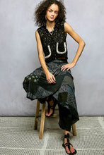 Black lace sleeveless cropped crochet vest with white horseshoe embroidery and scalloped edge pol button down detail