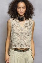 Beige pol button down cropped crochet vest with scalloped edge and floral lace sleeveless design with button closures